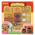 Calico Critters Bakery Shop Starter Set retail packaging in red and yellow box with clear plastic window showing brick oven, bread pieces, shelves, baker outfit, and accessories inside.