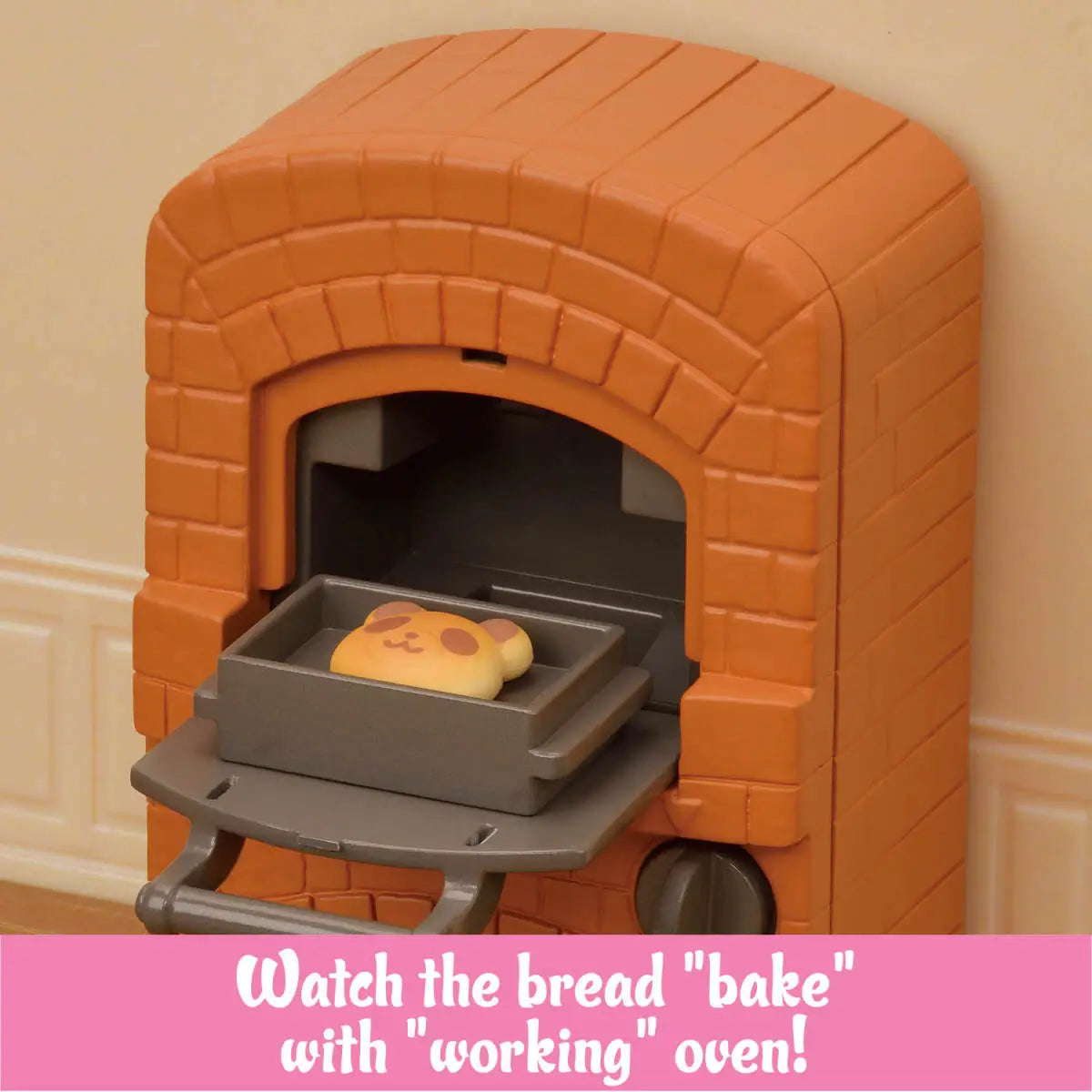 Calico Critters working brick oven in orange textured plastic with arched opening and gray sliding tray holding baked animal bread inside dollhouse bakery wall backdrop.