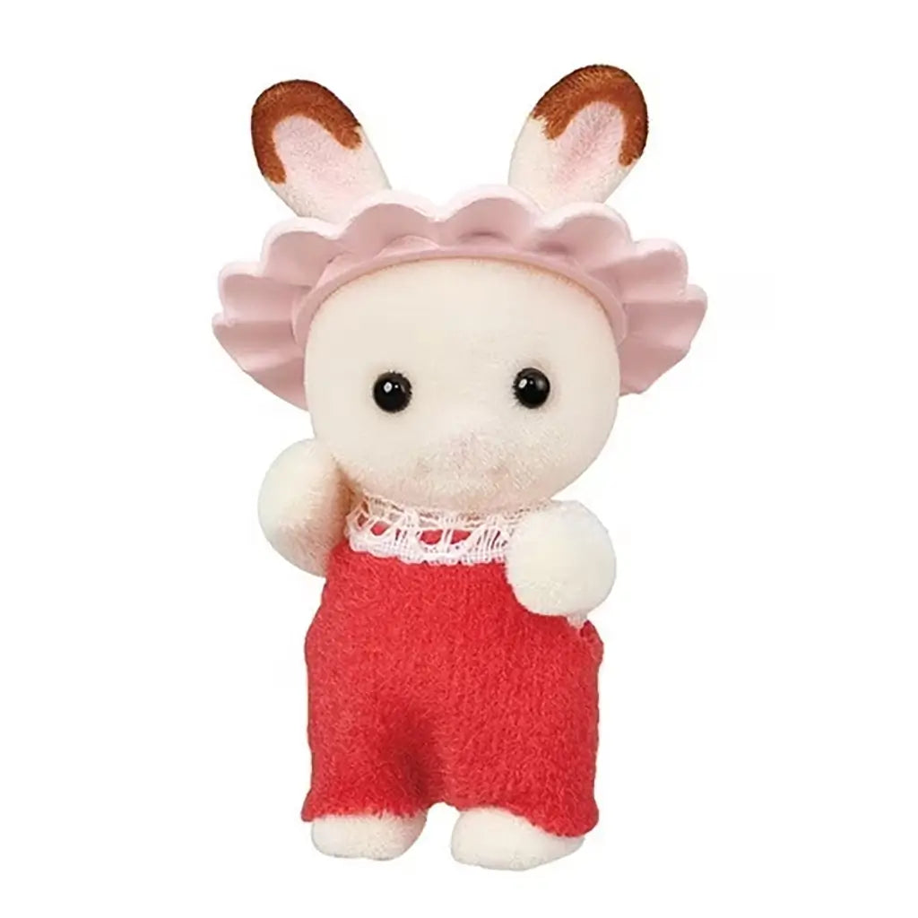 Calico Critters baby rabbit figurine wears a pink flower-shaped shower cap and red overalls with lace trim, designed as part of the miniature Bath & Shower Set collection.