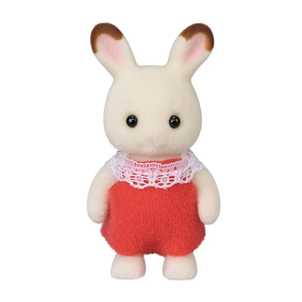 Calico Critters Chocolate Rabbit Baby features cream flocked fur, brown-tipped pink ears, black eyes, and soft red overalls finished with a white lace collar.