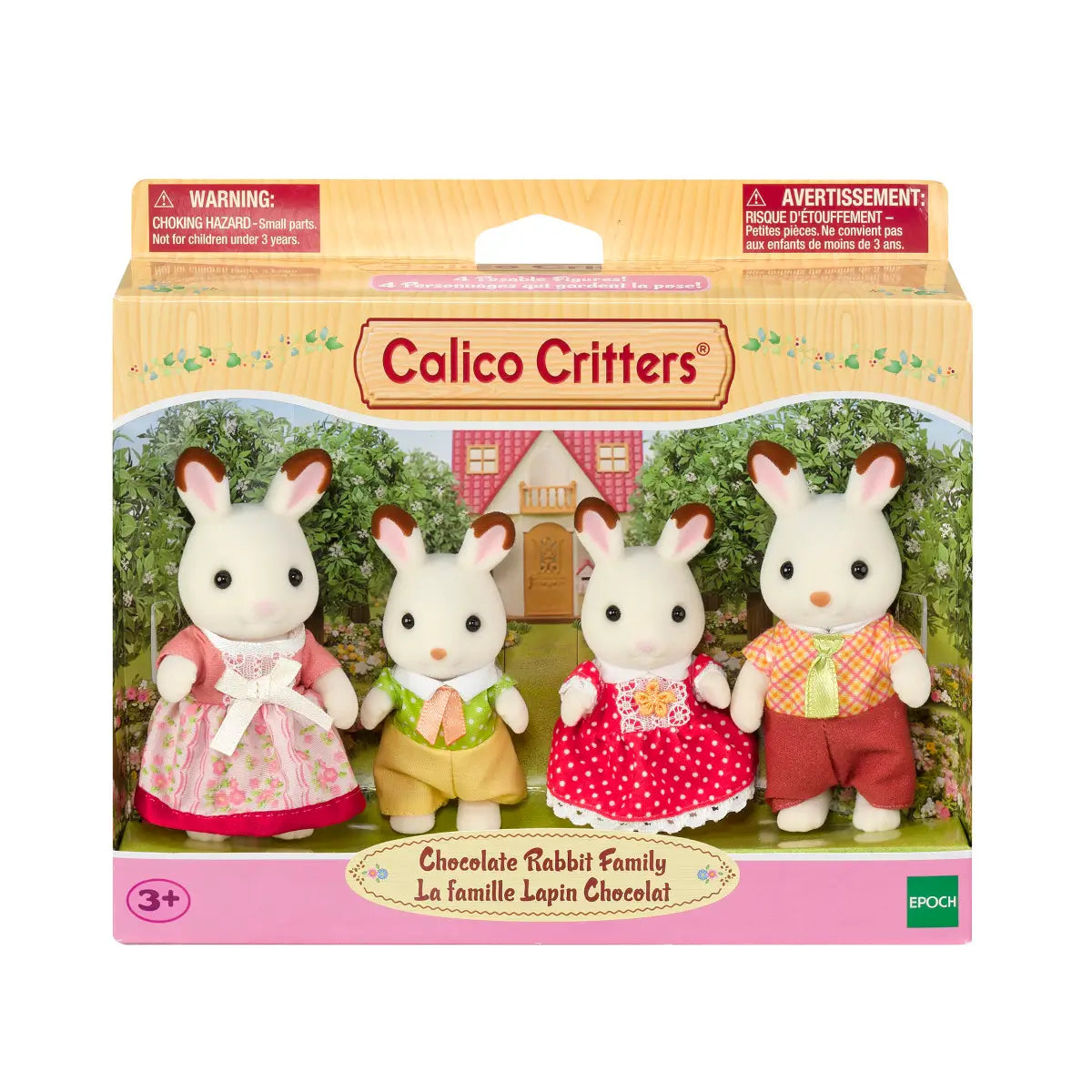 Calico Critters Chocolate Rabbit Family toy set featuring four white rabbits with brown ear tips dressed in colorful fabric clothes, displayed in garden-themed packaging with a pink house backdrop.