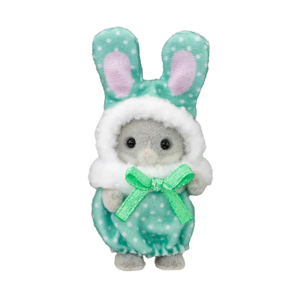 Calico Critters baby figure has gray flocked fur and a mint polka-dot plush bunny costume with tall ears, white fuzzy trim, and a green satin bow on a white background.