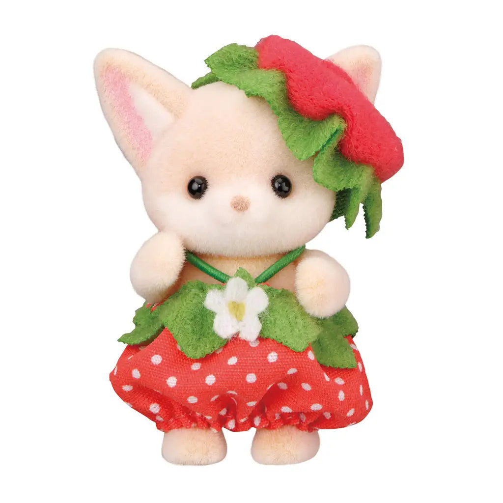 Calico Critters Very Berry Babies fox figure in cream flocked material, featuring pointed ears and black eyes, dressed in a red polka-dot strawberry skirt with green leaf collar and berry hat for collectible pretend play.