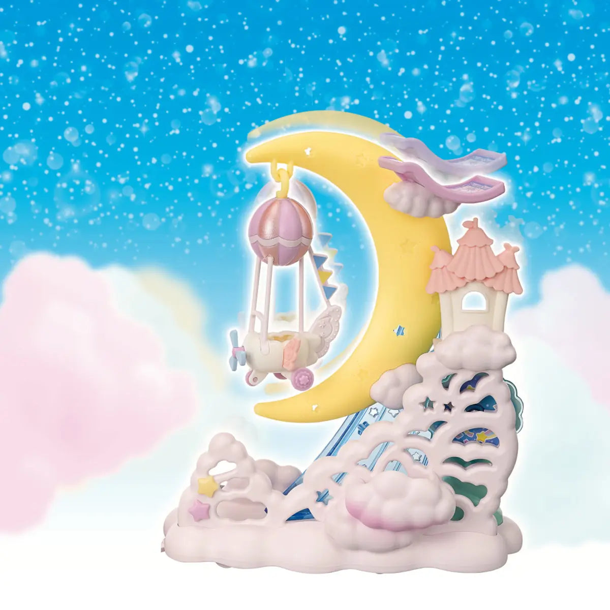 Calico Critters Daydream Parade Playset featuring a pastel yellow crescent moon with a pink balloon swing, cloud base, and whimsical castle tower, set against a starry blue sky background.