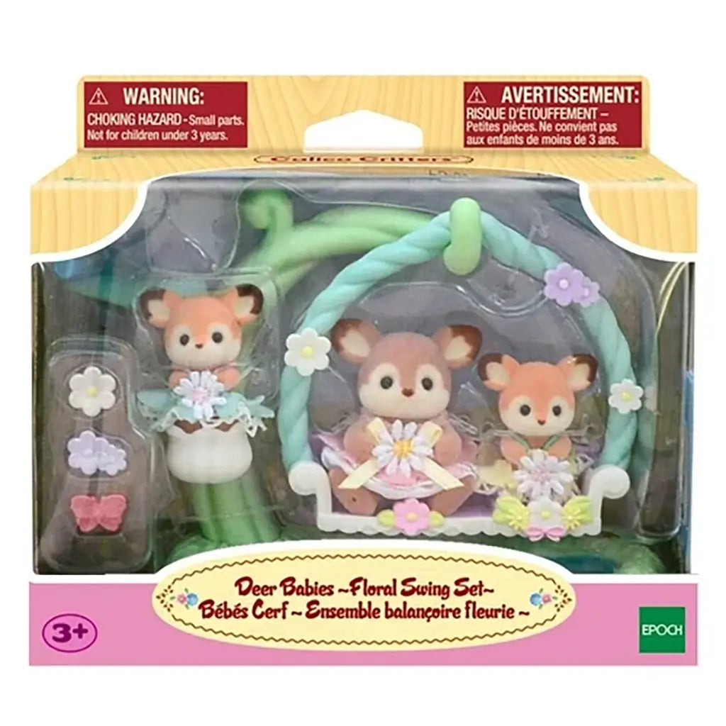 Calico Critters Deer Babies Floral Swing Set retail package displaying three deer baby figures with floral swing and accessories inside a clear window box labeled with product name and age guide.
