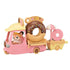 Calico Critters Dip Dip Donuts wagon toy features a pink three-wheeled truck with a large chocolate donut display, yellow roof, and a fox figure driver, pulling a cart with pink donut and umbrella.