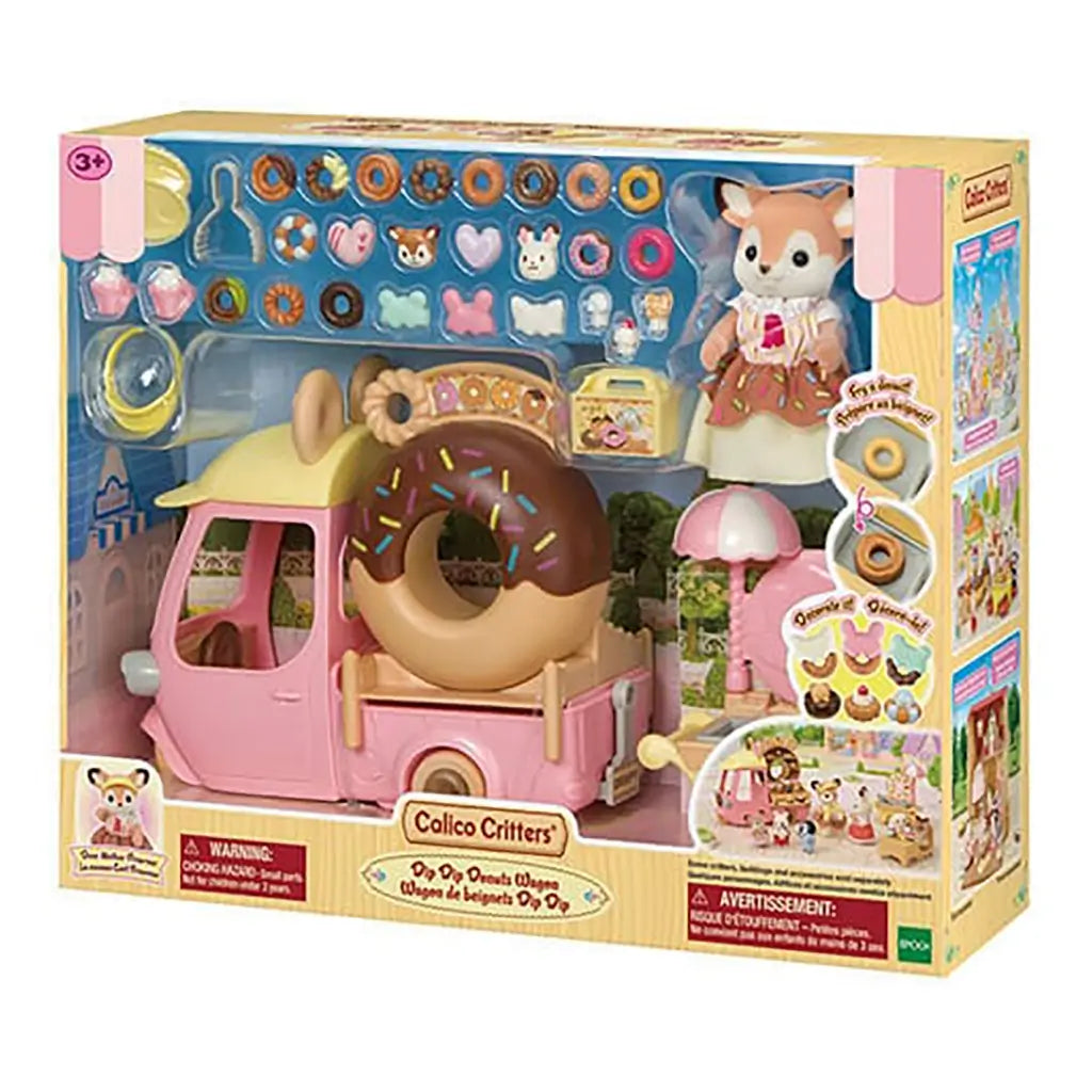 Retail package of Calico Critters Dip Dip Donuts Wagon playset shows pink donut truck, accessories, miniature pastries, fox figurine, and branding for children ages three and older.