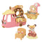 Calico Critters Dip Dip Donuts playset includes a pink truck with chocolate donut sign, fryer cart, fox figure, and display shelves filled with colorful toy donuts and pastries.