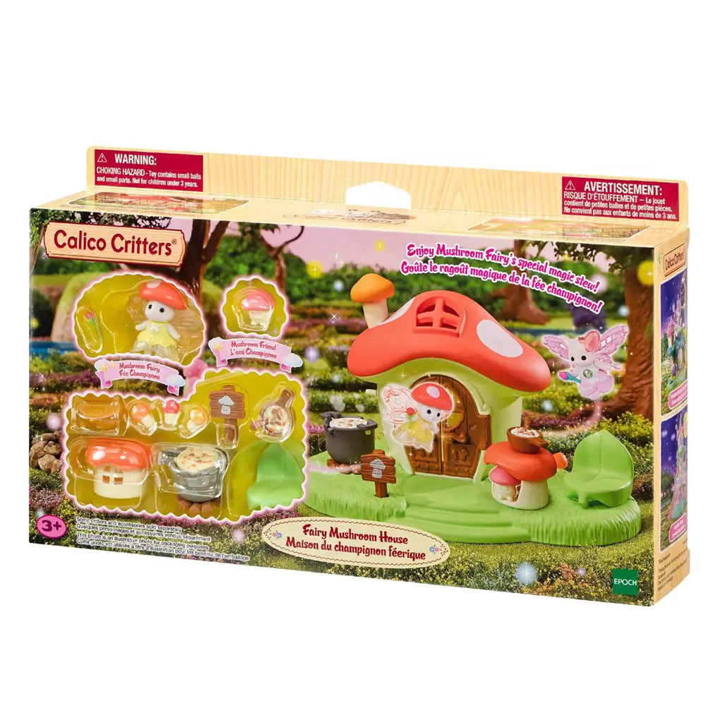 Calico Critters Fairy Mushroom House package displays the orange-roof cottage, Mushroom Fairy, cooking accessories and leaf chair against a sparkling woodland scene.
