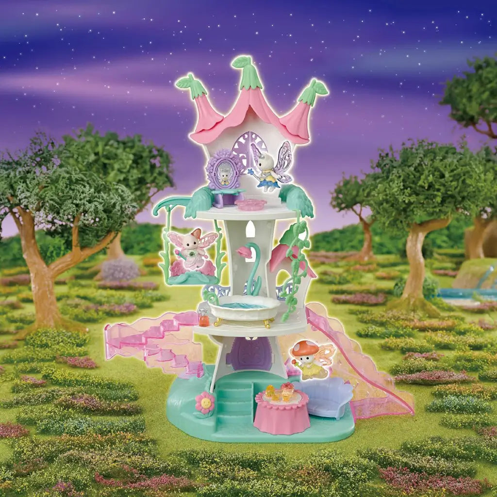 Calico Critters Fairytale Tower playset displays pastel pink, mint and white levels with fairy figures, swing, stairs, furniture and tea table in a magical garden scene.