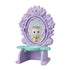 Calico Critters fairy dresser is lavender molded plastic with floral details, an oval glittery mirror showing a winged cat fairy, and a mint green shelf on white.
