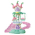 Calico Critters Fairytale Tower is a white plastic playset with pink petal roofs, mint vines and base, purple doors, a flower swing, balcony, and translucent pink stairs.