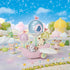 Calico Critters Floral Fantasy Skyship in pastel pink, blue and mint plastic carries a winged Latte Cat baby through a whimsical garden scene with other animal figures.