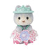 Calico Critters Husky Cradle Baby wears a pastel pink lace skirt and teal tiara-style hat, holding a tiny blue flower accessory while posed upright.