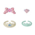 Calico Critters princess accessories include a pink bow, rose-shaped ring, pearl-trimmed tiara, and mint-green crown, each styled with jewel-like details.