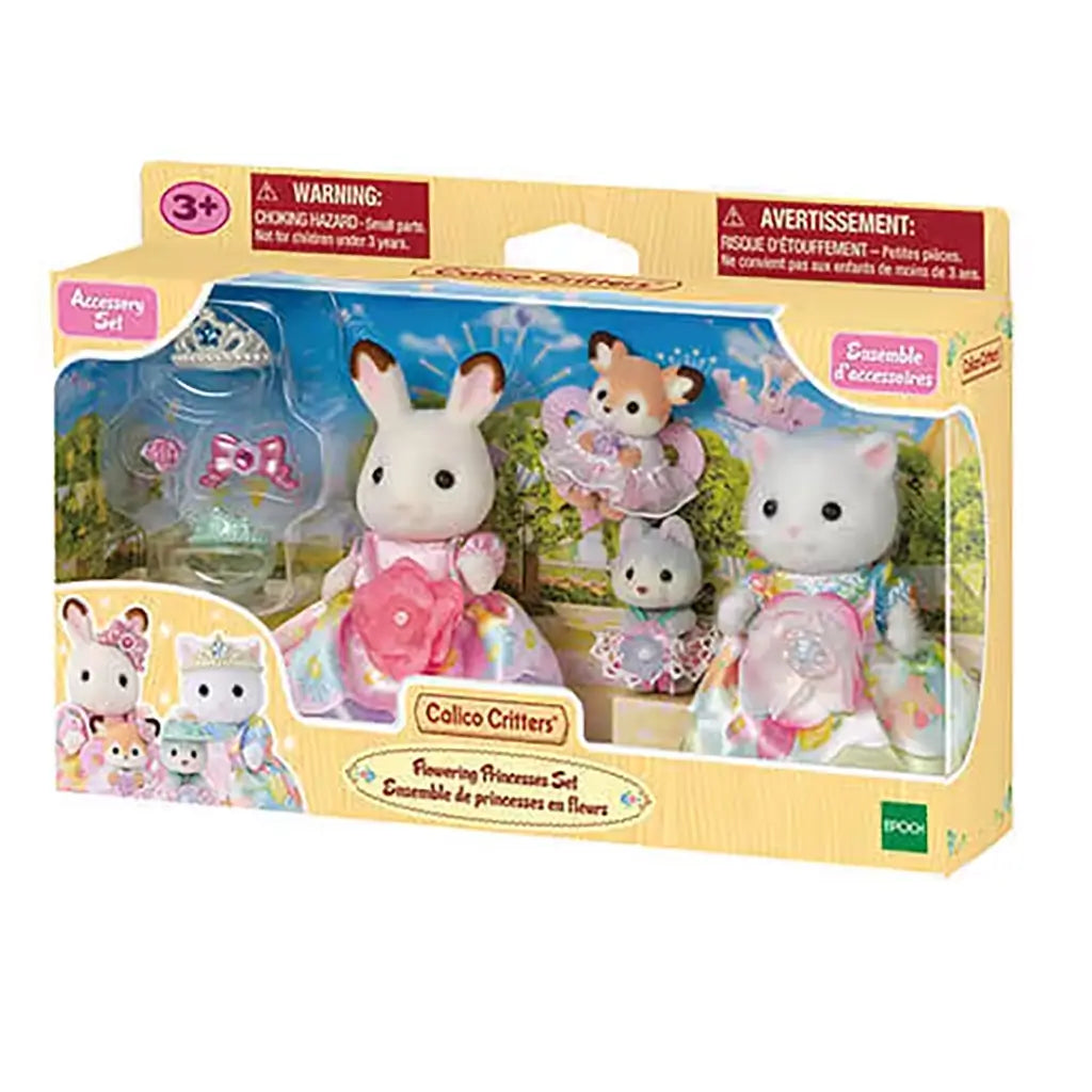 Boxed Calico Critters Flowering Princesses Set shows bunny, cat, deer, and husky figures in floral gowns with accessories displayed against a scenic background.