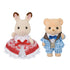 Calico Critters Freya and Theo Anniversary Friends set with cream rabbit and tan bear figures in lace-trimmed red dress and blue plaid suit, standing against white background.