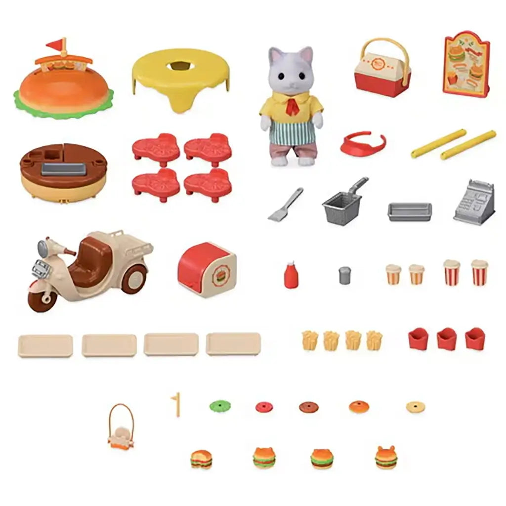 Calico Critters Hamburger Stand accessories laid out with burger canopy parts, cat vendor, scooter, trays, stools, fryer, register, fries, drinks, toppings, and mini burger pieces.