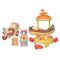 Calico Critters Hamburger Stand toy set including burger-shaped kiosk with grill, yellow table, stools, cat vendor figure in red visor, scooter, and miniature fast food items.