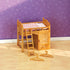 Calico Critters wooden loft bed with ladder, cabinet door, bottom drawer, and two small hangers placed on a light wood floor against purple patterned wallpaper.