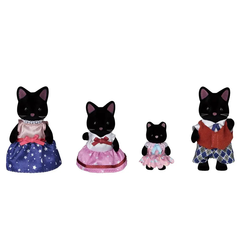 Calico Critters Midnight Cat Family features four black flocked cat figures with pink ears, dressed in purple, pink, blue and red pastel outfits on a white background.