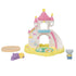Complete Calico Critters nursery sandbox and pool playset featuring castle structure with slide, rainbow details, shallow pool area with float rings, round stage platform, purple toy train, and baby elephant figure.