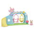 Calico Critters Nursery Swing playset with pastel arch, yellow slide, pink and yellow swings shaped like butterflies and bees, plus baby rabbit figure in pink outfit.