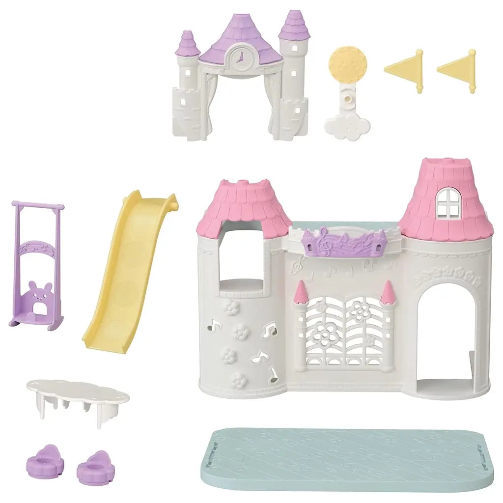 Complete Calico Critters Playtime Castle Nursery set with detachable parts including a castle frame, yellow slide, flags, table, chairs, swing, and blue play mat for creative assembly and play.