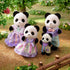 Calico Critters Pookie Panda Family features four black-and-white flocked panda figures in lavender and pastel outfits, posed together in a miniature garden setting.