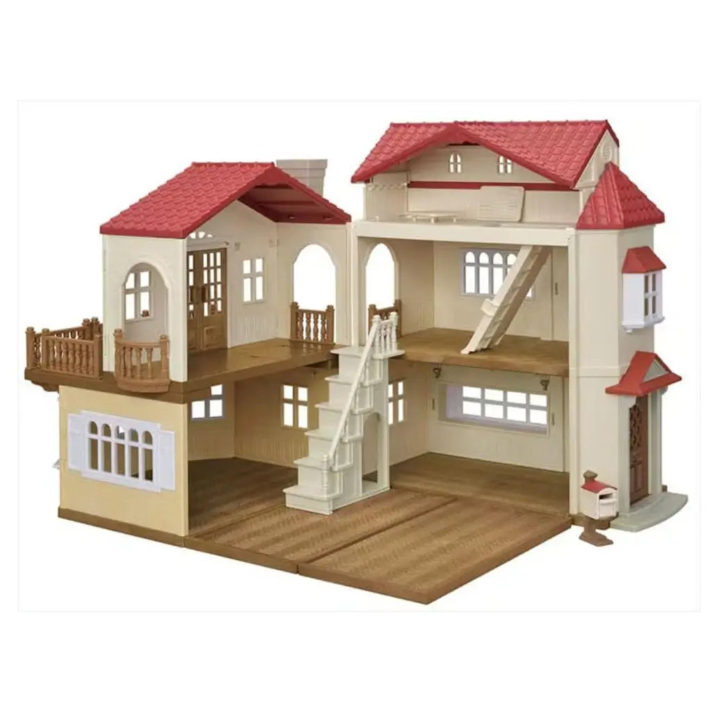 Toy dollhouse with cream walls, textured brown floors, red shingled roof, arched windows, balcony, and central staircase, designed as a Calico Critters Red Roof Country Home playset.