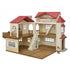 Toy dollhouse with cream walls, textured brown floors, red shingled roof, arched windows, balcony, and central staircase, designed as a Calico Critters Red Roof Country Home playset.