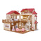 Calico Critters Red Roof Country Home gift playset features beige plastic dollhouse with red shingle roof, arched windows, balcony railings, and furnished rooms displayed on white background.