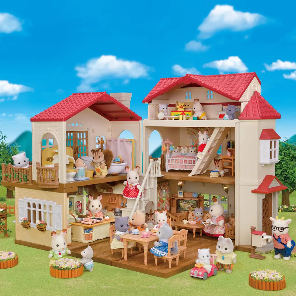 Calico Critters Red Roof Country Home fully set up with furnished rooms and many animal figures, showing a lively family scene with dining, playtime, and cozy details.