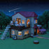 Calico Critters Red Roof Country Home shown at night with warm glowing lights, rabbit family figures on the balcony, trees, and a pink toy car in a starry outdoor setting.