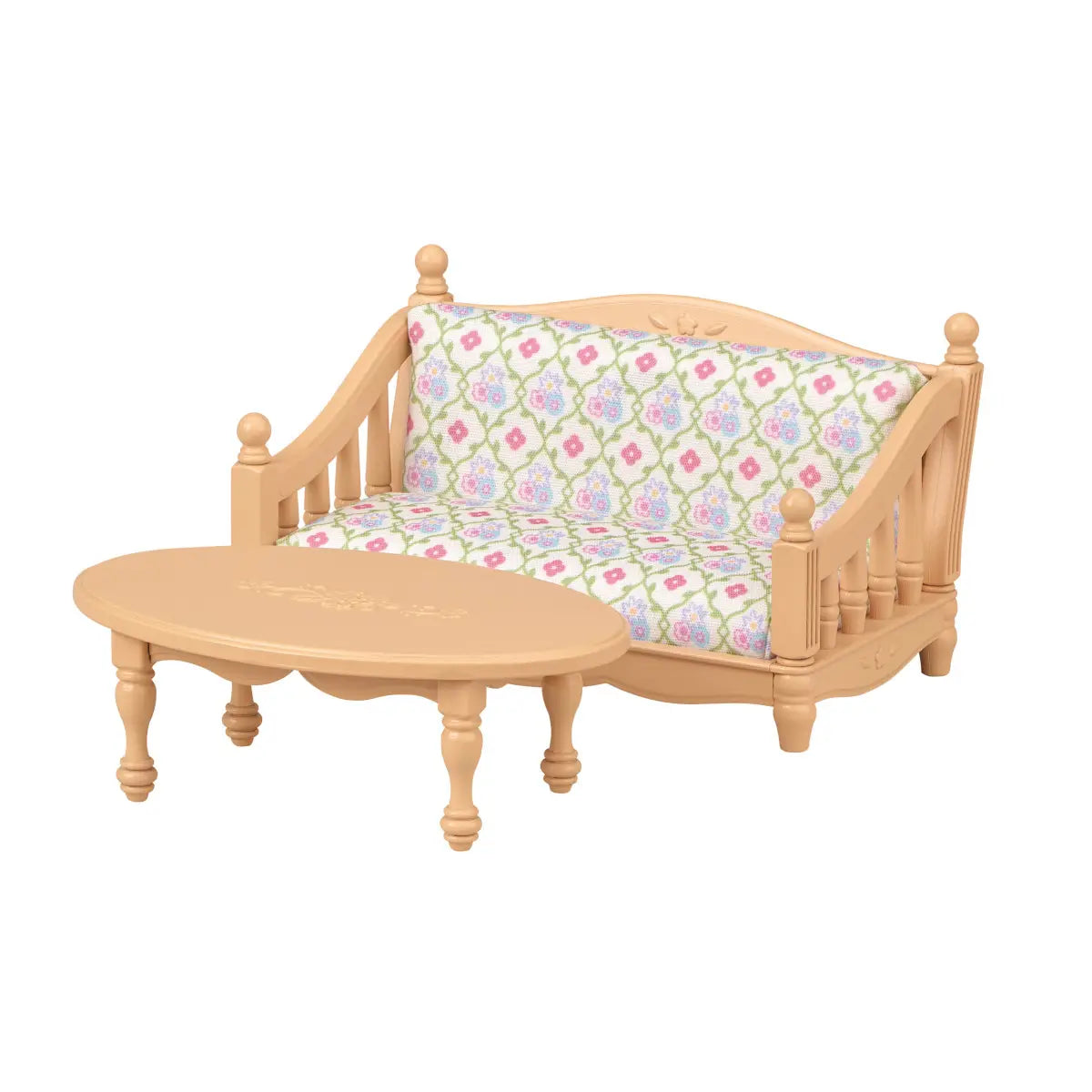 Tan miniature wooden-style sofa and oval coffee table with pink, green, and white patterned cushions, crafted as part of a Calico Critters dollhouse furniture living room set.