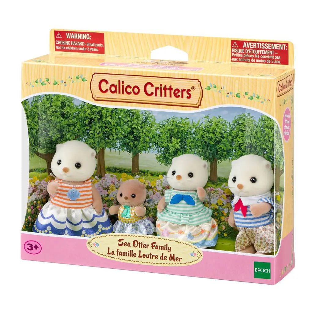 Calico Critters Sea Otter Family package displays four cream and tan flocked otter figures in colorful fabric outfits inside a windowed box with a garden backdrop.