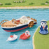 Calico Critters Seal Sailor's Leisure Boat set shows a navy, white, and red paddle boat with two small boats and a sailor figure beside a grassy turquoise waterway.
