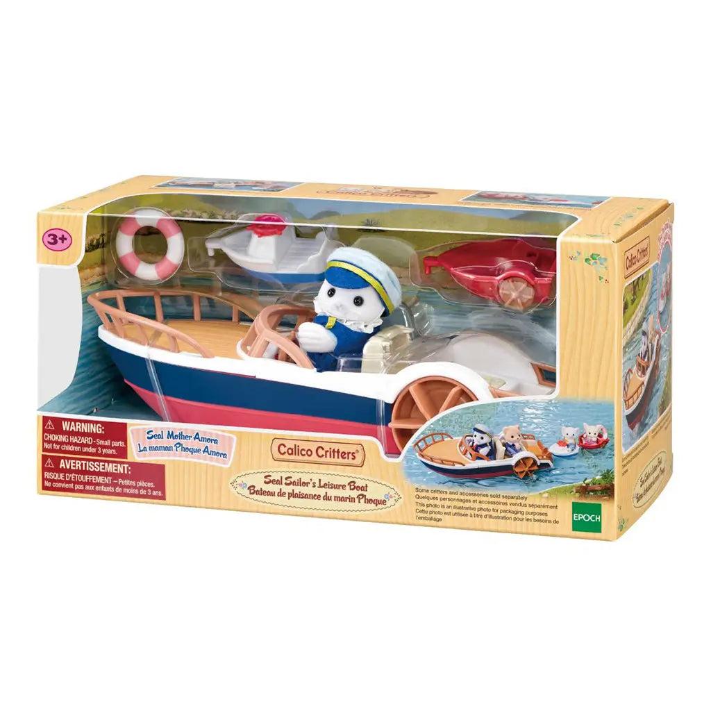 Calico Critters Seal Sailor's Leisure Boat boxed set displays a navy, white, and red paddle boat, Seal Mother Amora figure, red dinghy, small white boat, and life ring.