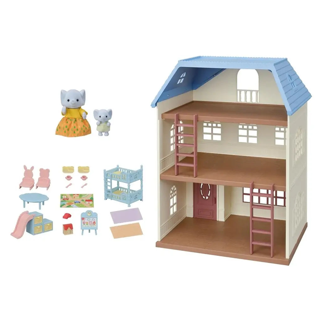 Calico Critters Sky Blue Terrace set displayed with house, blue roof, critter figurines, pink chairs, blue bunk bed, play mat, easel, and small toy accessories arranged nearby.