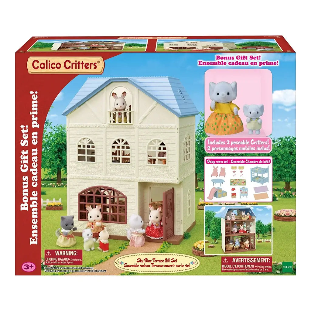 Calico Critters Sky Blue Terrace Gift Set box shows cream-colored three-story dollhouse with blue roof, front yard, bonus critters, baby room furniture, and outdoor play scene.