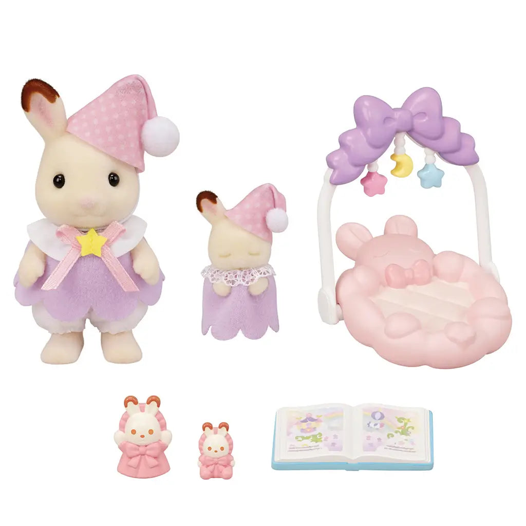Calico Critters Sleepy Dream Siblings full contents, including a big bunny figure, baby bunny, pastel pink cradle swing with star mobile, dolls, and illustrated storybook.