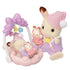 Calico Critters Sleepy Dream Siblings set featuring a cream bunny in purple pajamas with a pink nightcap, holding toys beside a baby bunny resting in a pastel pink cradle swing.