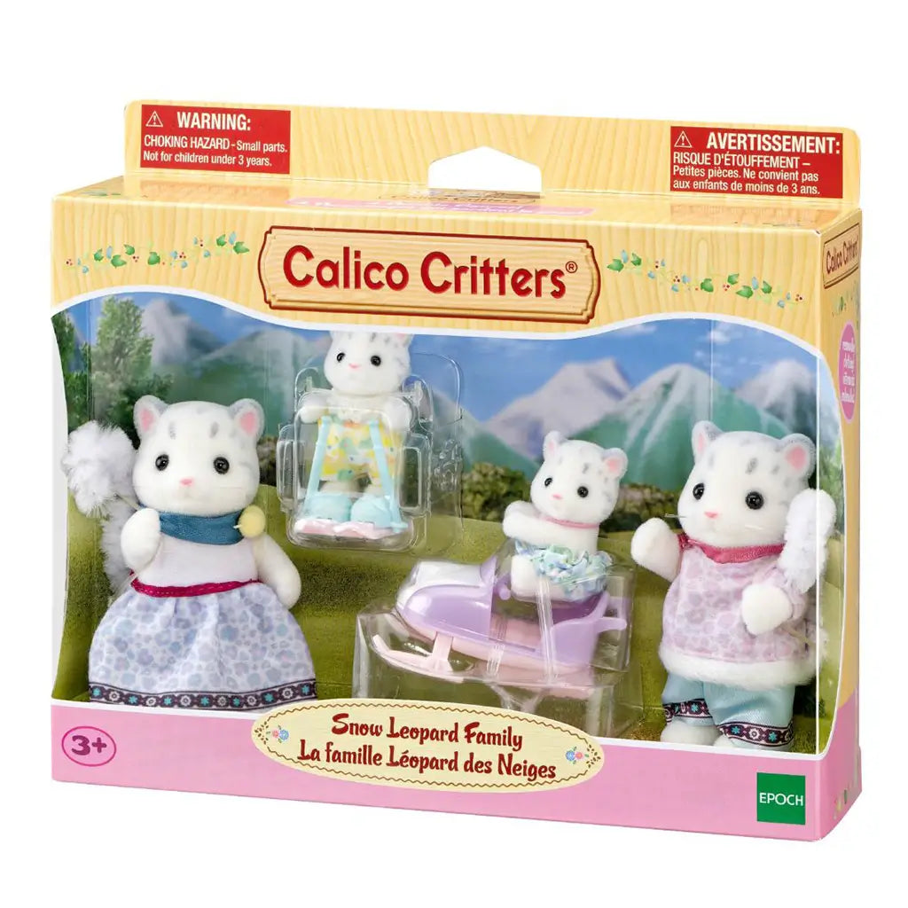 Calico Critters Snow Leopard Family boxed set displays four white flocked figures with winter outfits, plus pastel skis and a lavender snowmobile behind clear packaging.