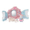 Calico Critters Style & Sparkle Dressing Room toy playset opened to reveal pink and blue carriage with mirror, sofa, table, accessories, and rabbit doll in dress holding handbag.