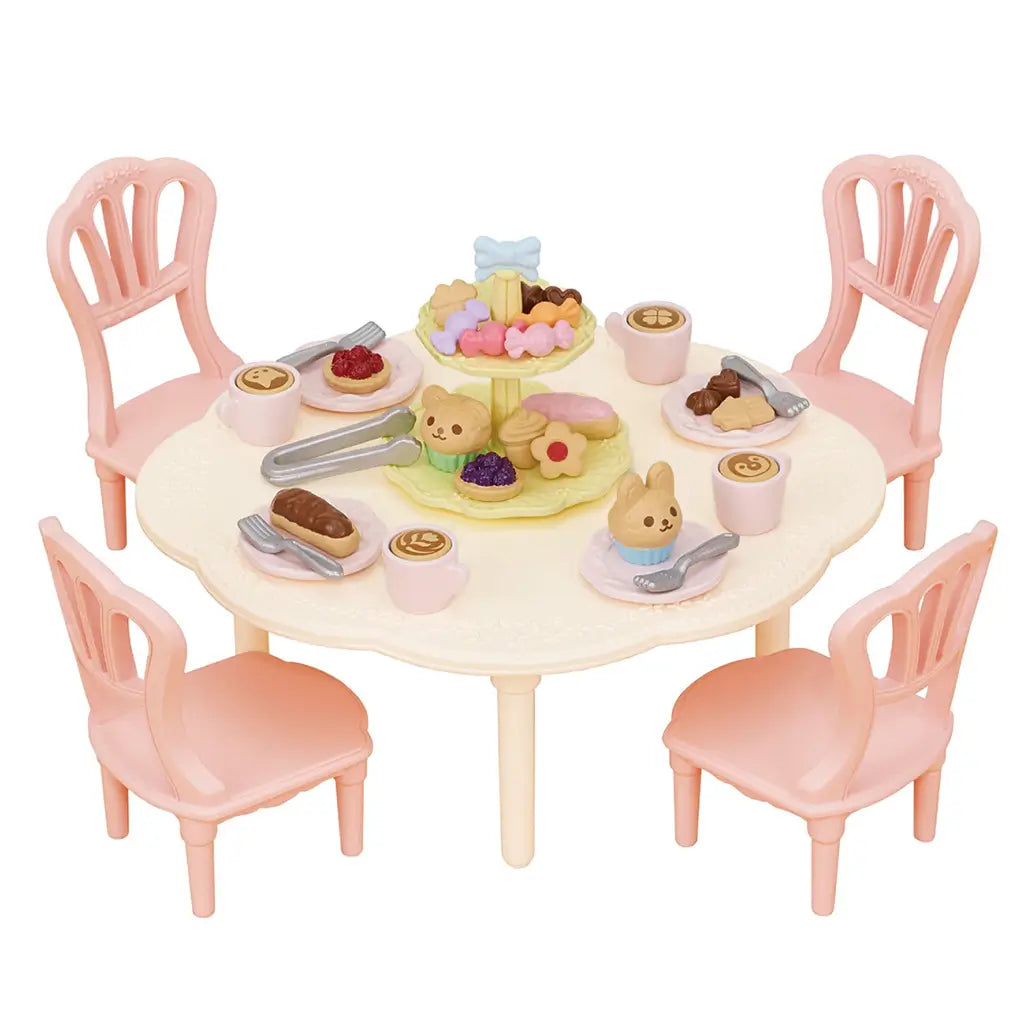 Calico Critters Sweets Party Set with pastel round table, four pink chairs, plates, forks, and desserts including cupcakes, eclairs, and tiered treat stand.