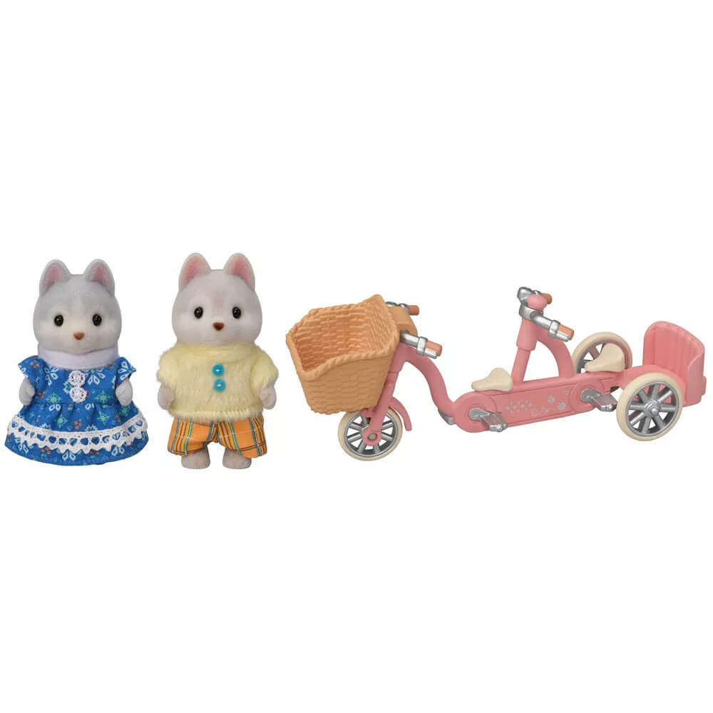 What is included with the Calico Critters Tandem Cycling Set with Husky Sister & Brother