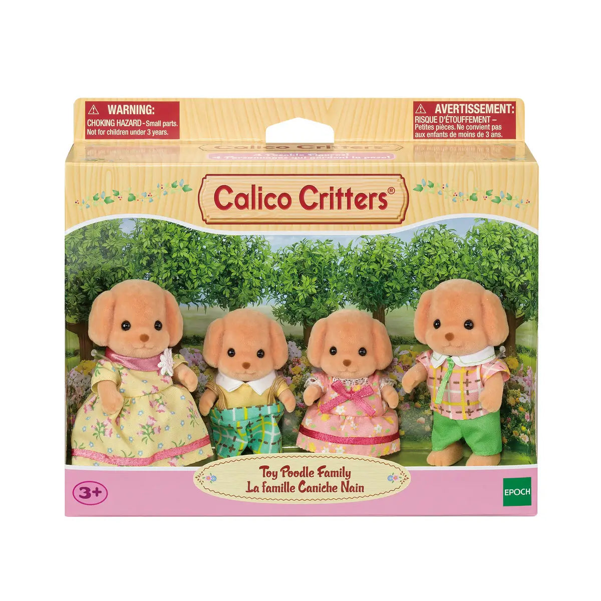 Calico Critters Toy Poodle Family set features tan flocked poodle figures in floral dress, plaid shirts, and pastel outfits displayed in retail box with garden backdrop.