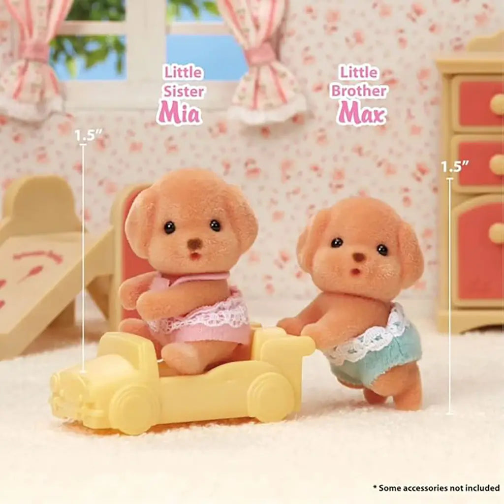 Calico Critters Toy Poodle Twins figurines Mia and Max, each 1.5 inches tall, shown in a dollhouse nursery setting with one riding a yellow car and the other standing beside.