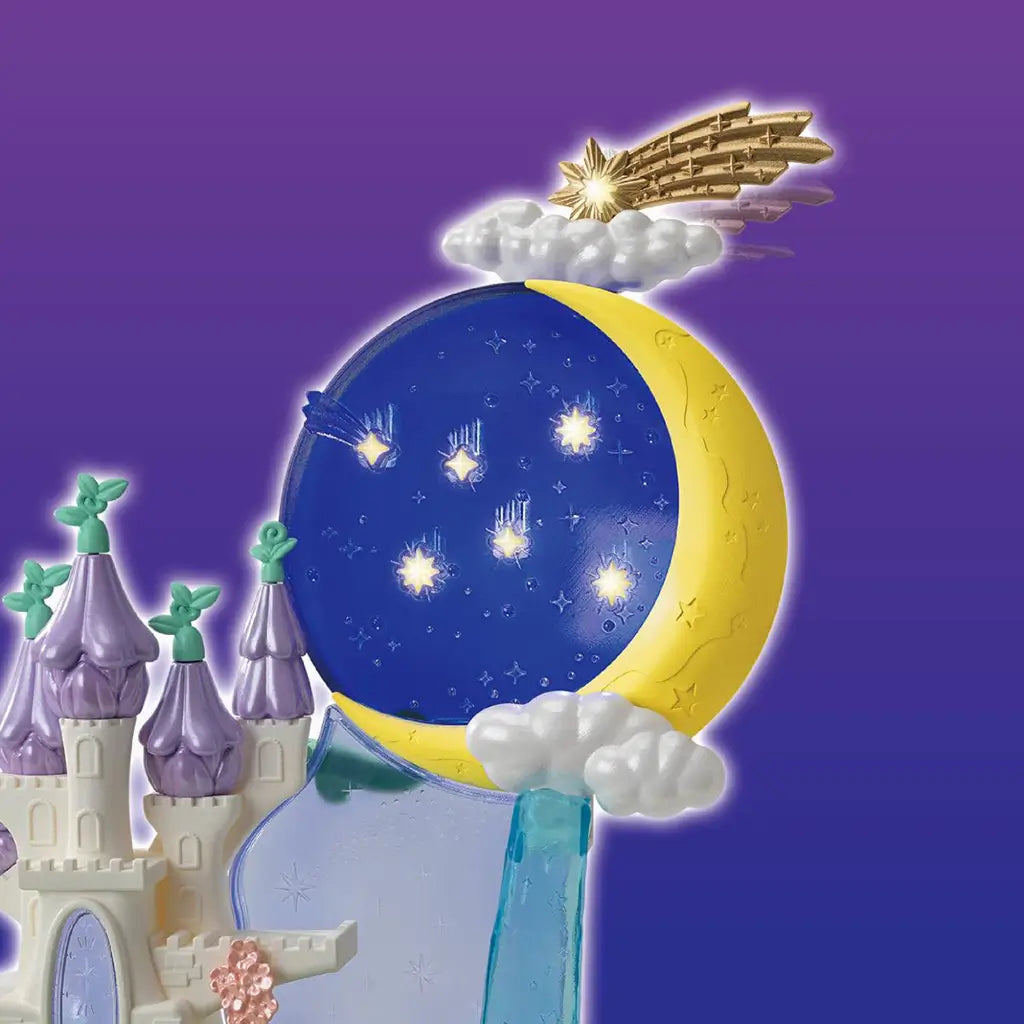 Calico Critters fairy castle moon has a deep blue starry disk framed by a yellow crescent, pearly clouds, and a gold shooting star above a white castle on purple.