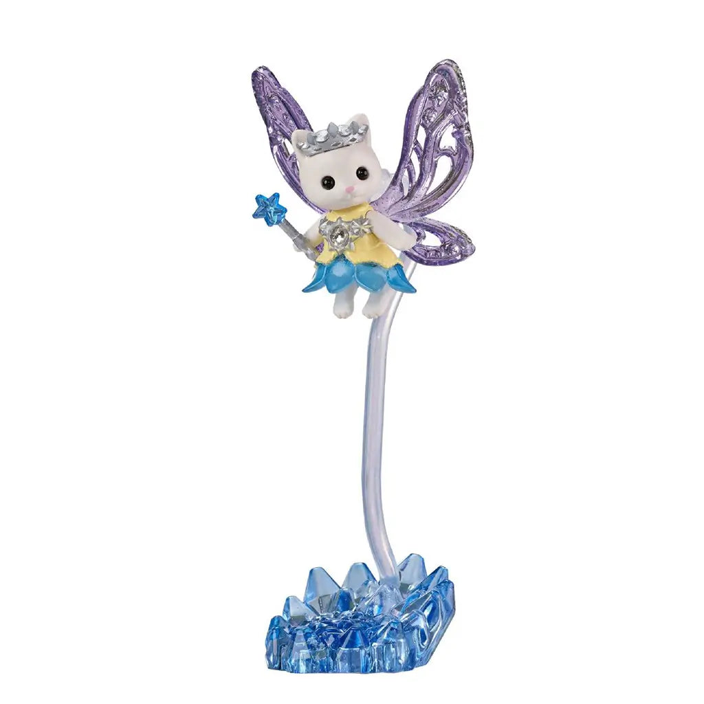 Calico Critters fairy stand features a white cat fairy in yellow and blue with translucent purple wings and a star wand, raised on a clear stem above a blue crystal base.